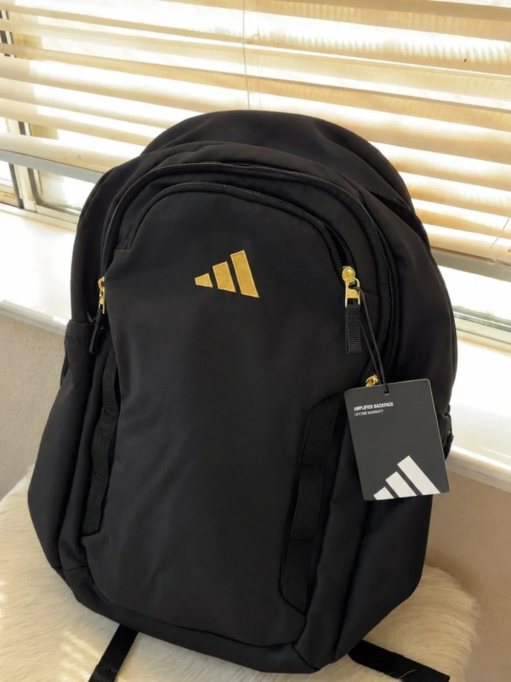 adidas Black Backpack with Gold Logo and Zipper Details